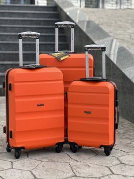 Wings Ударостійка пластикова Валіза Середня ( M ), на колесах Wings AT01 (orange) M Оранжевый Wings AT01 (orange) M фото